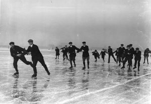 January 1908: Skating arm in arm on Cowbit Wash, Spalding, Lincolnshire. (Photo by Hulton Archive/Getty Images)